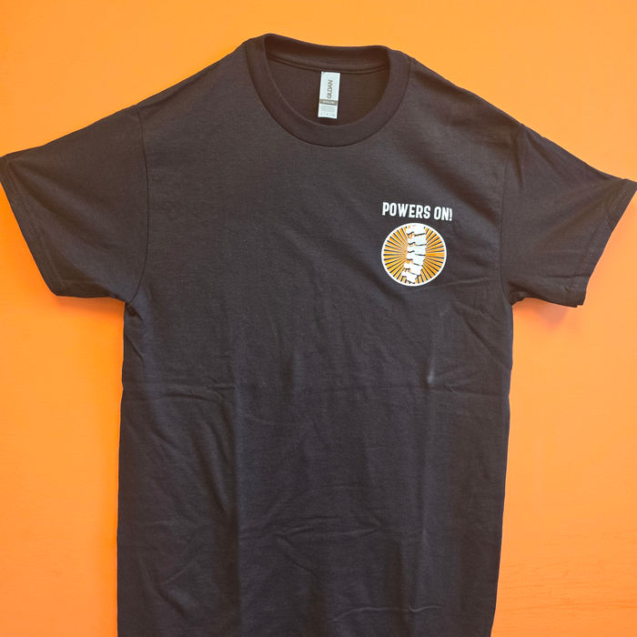Black t-shirt screen-printed with the Powers On! logo