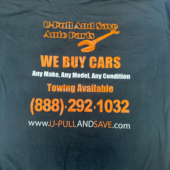 Black t-shirt screen-printed with U-Pull & Save Auto Parts branding